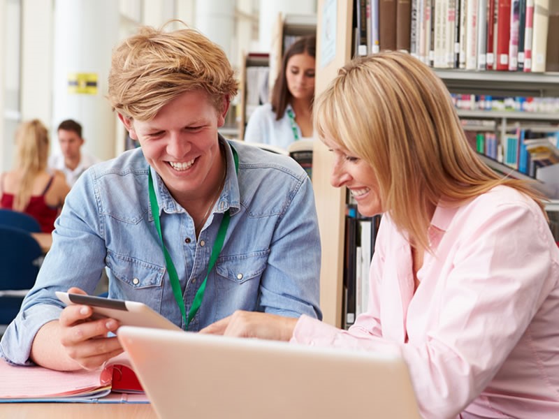 Photograph of teacher with teenage pupil