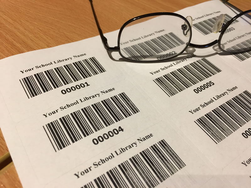 School barcodes with glasses on desk